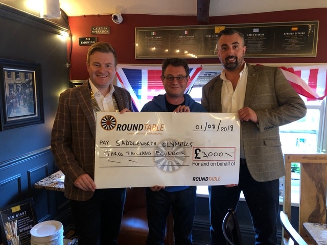 Cheque mates: Pictured (left to right) are Andrew Rothwell, chairman of Saddleworth Round Table, Adrian Green, chair of Saddleworth Village Olympics, and Matthew Sykes, Table’s community support officer