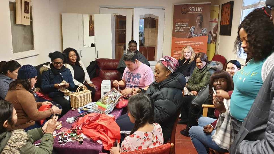 Sawn service users enjoying a coffee morning (prior to them moving to Zoom)