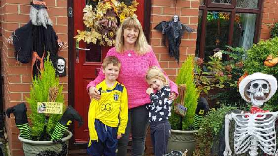 Tracy Buckley is pictured with her children, Frankie, eight, and Scarlett, six, at their house