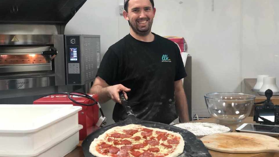 Kyle Freeman making another lovely pizza
