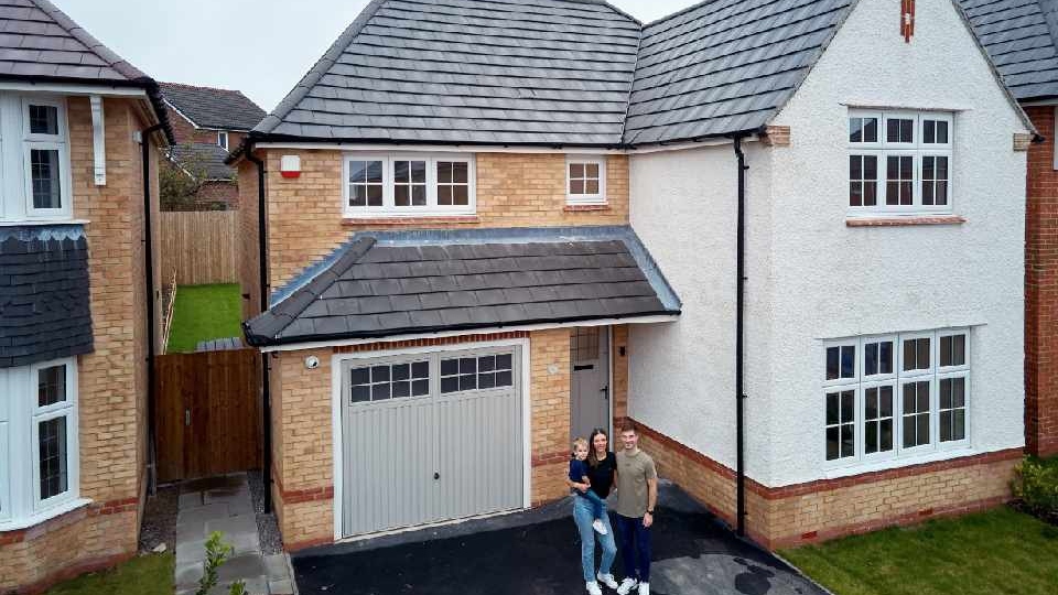 Megan Jones and Phil McGrath with son Harley outside their new home at Saddleworth View Megan Jones and Phil McGrath with son Harley outside their new home at Saddleworth View