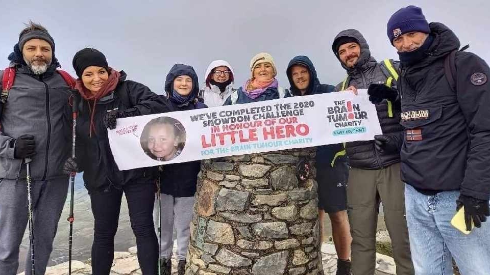 The dedicated team pictured after their gruelling fundraising walk to the top of Mount Snowdon