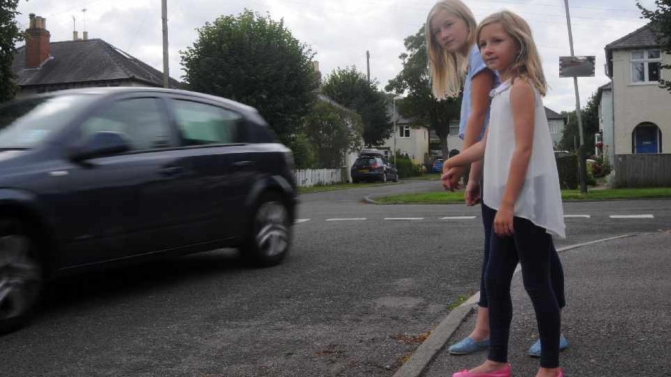 Charlotte and Emily watch a car speed by. Picture courtesy of Rob Lacey Charlotte and Emily watch a car speed by. Picture courtesy of Rob Lacey