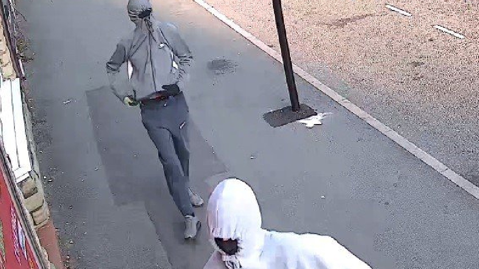 Greater Manchester Police are looking for these two men in connection with the robbery back in September.