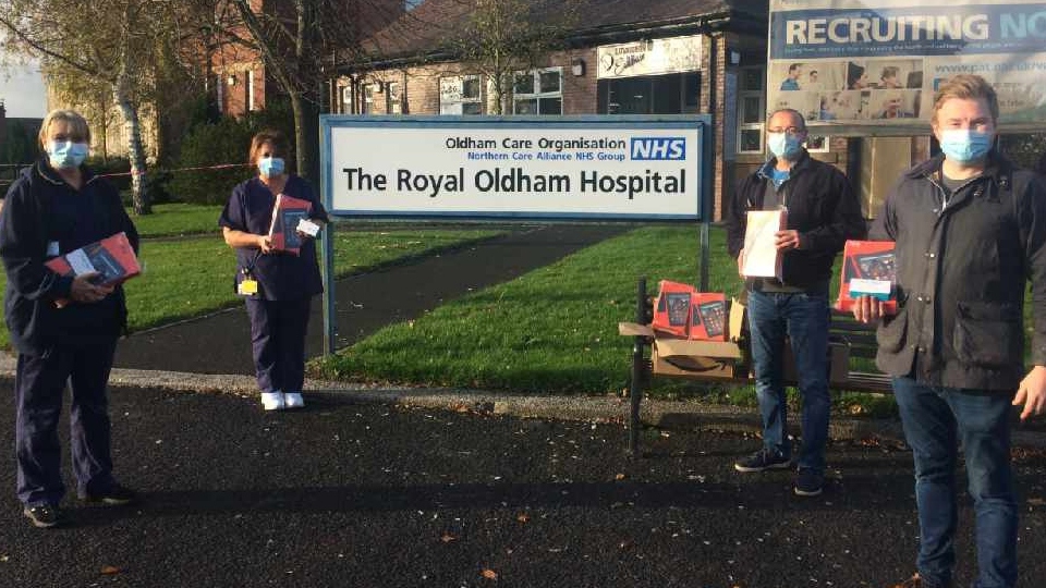 Critical Care Lead Nurse Helen Barrow and Senior Sister Maria Daynes receive kind gifts from Andrew Bagley and Andrew Rothwell of Saddleworth Round Table