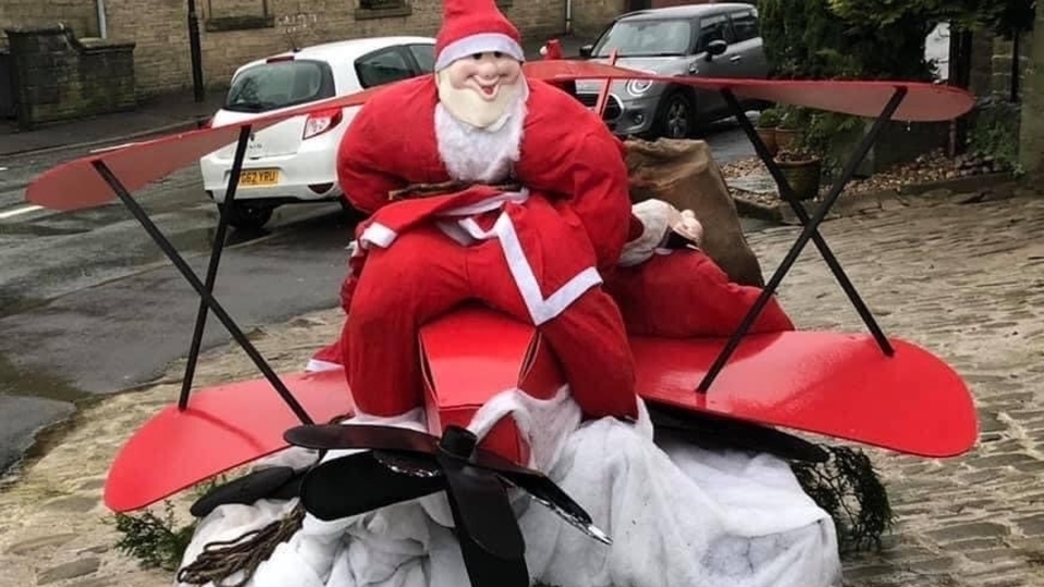 The amusing Santa has appeared outside the Junction Inn at Denshaw The amusing Santa has appeared outside the Junction Inn at Denshaw