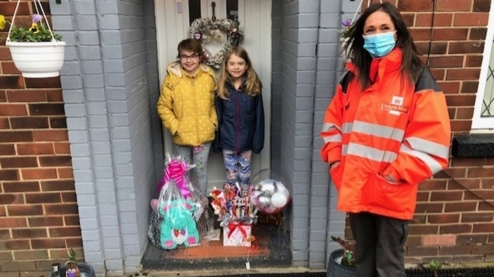 Laraine from Royal Mail in Oldham makes her special delivery to Abigail and her sister Annabel Laraine from Royal Mail in Oldham makes her special delivery to Abigail and her sister Annabel