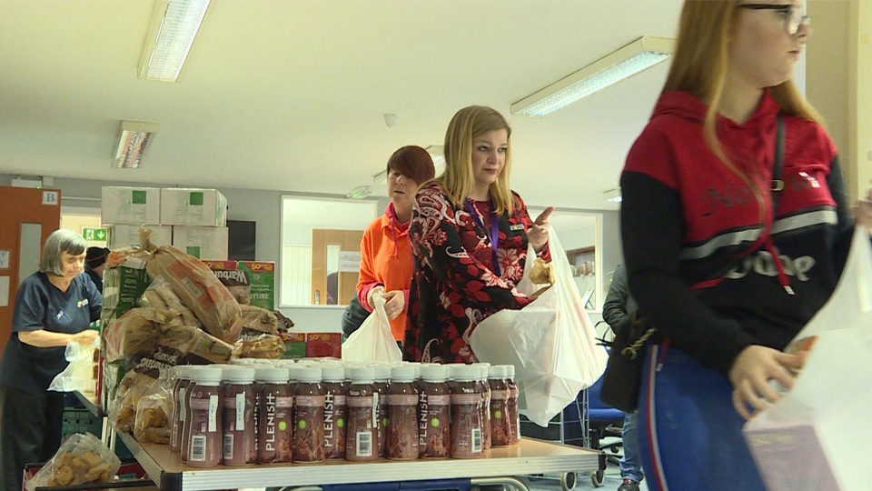 Volunteers sorting food for the new partnership