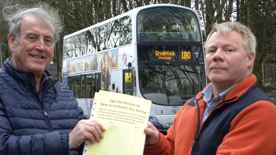 Dr Richard Knowles (left) receiving the petition from Mick Scholes (right)