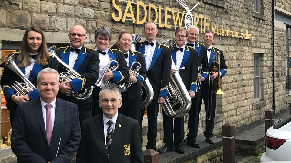 Members of Uppermill Band outside the Saddleworth Museum and Gallery