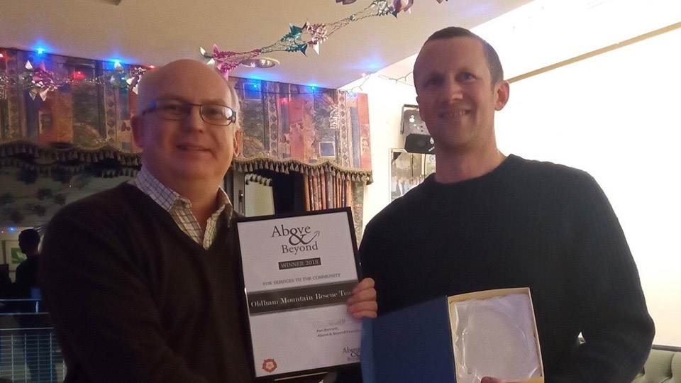 Cllr Jamie Curley, left, seen presenting the coveted Above and Beyond award to Rob Tortoishell, OMRT leader, late last year