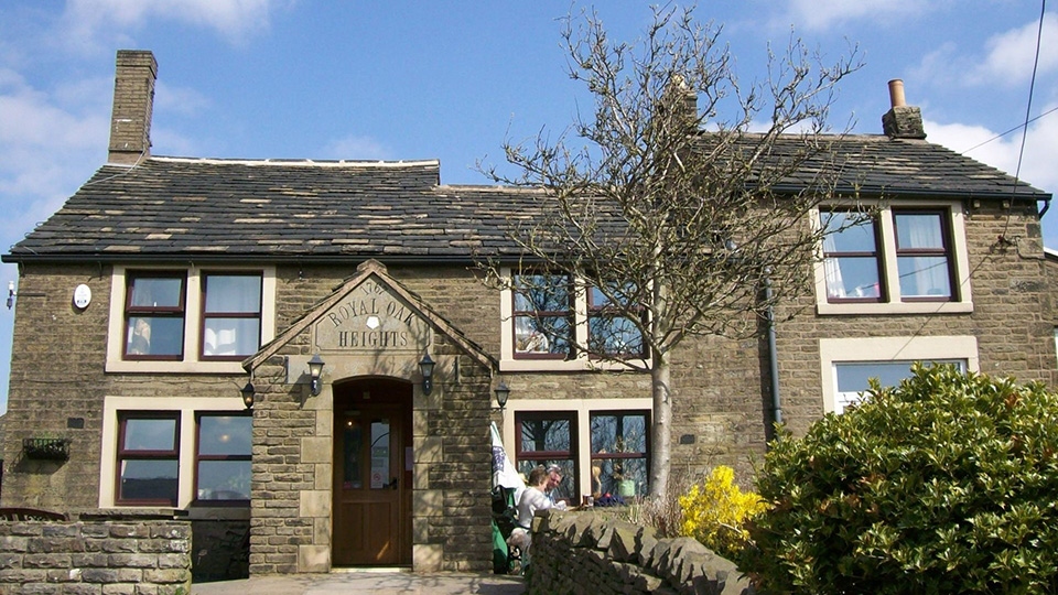 CLOSED: The Royal Oak stands opposite iconic St Thomas Church Friarmere at Heights, 1,200ft above Delph