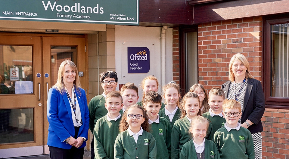 Happy staff and pupils at Woodlands Primary Academy