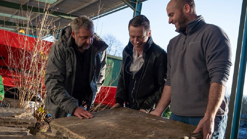 Peter Donegan (centre), Howard White, CED Stone Group, and Ed Burnham, Burnham Landscaping, inspect York stone salvaged from Oldham’s iconic Grade 2 listed Town Hall