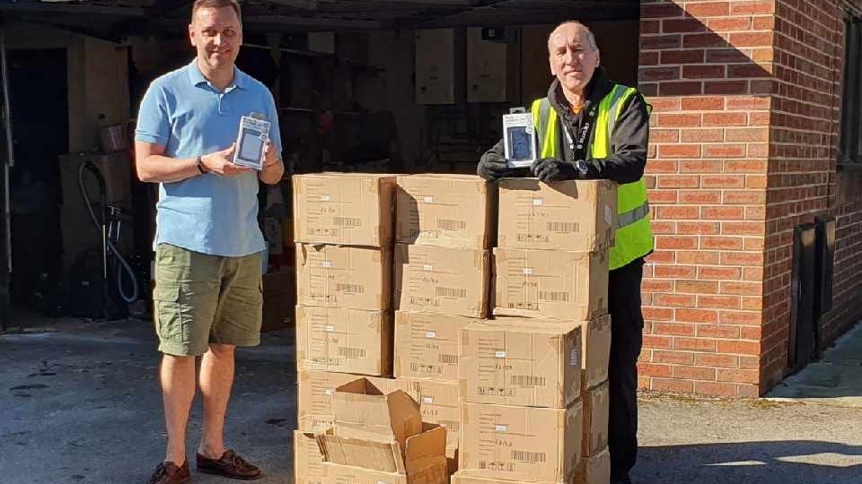 Pictured (left) is Mike Procter, from Saddleworth Round Table, taking delivery of the power banks
