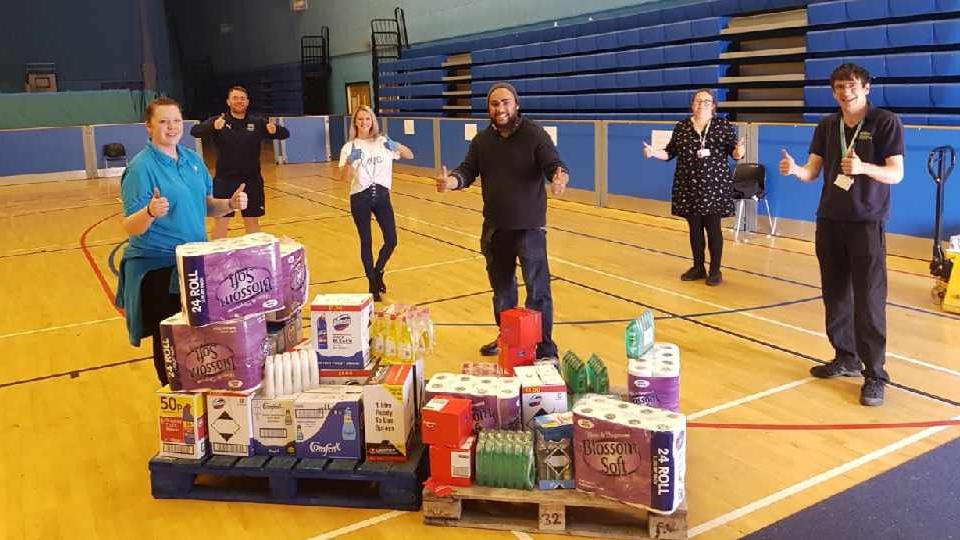 Our picture shows a donation and delivery to Action Together arranged by Ultimate Products' commercial director Jenny Stewart (in white). The drop-off included essential supplies including fabric conditioner, cleaning detergents, shower gels and toothpaste Our picture shows a donation and delivery to Action Together arranged by Ultimate Products' commercial director Jenny Stewart (in white). The drop-off included essential supplies including fabric conditioner, cleaning detergents, shower gels and toothpaste