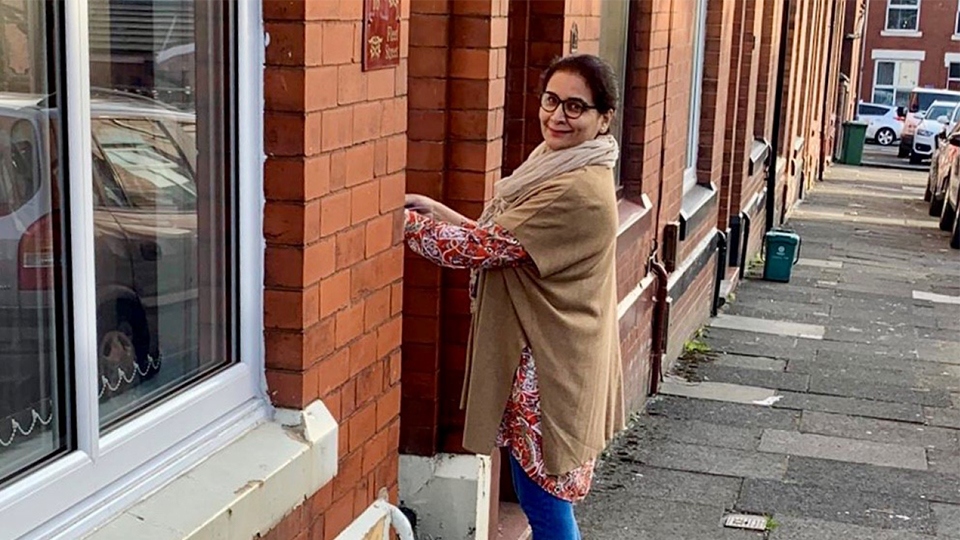 Saba Kazmi delivering cards to pupils