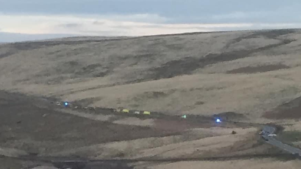 The scene on Huddersfield Road in Denshaw viewed from a distance