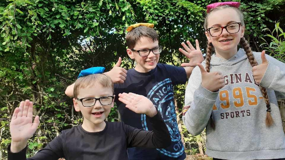 Eggs-cellent adventure: Oldham home-school heroes, Hannah (15), Elliott (13), and George Lyons (8) are launching a new DIY sports day pack from Cancer Research UK’s Race for Life Schools, in memory of grandmother Sue