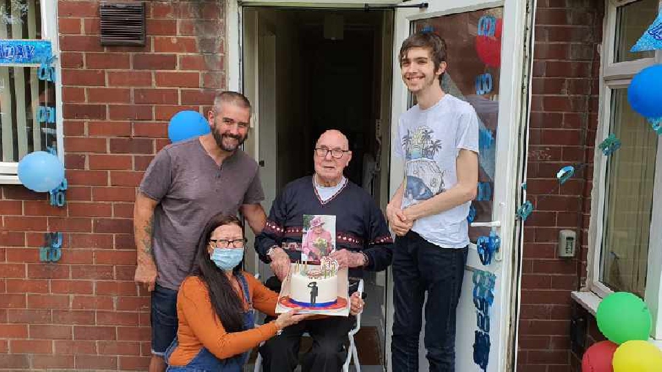 Elijah is pictured with grandson Martin, great grandson Charlie and caregiver Claire