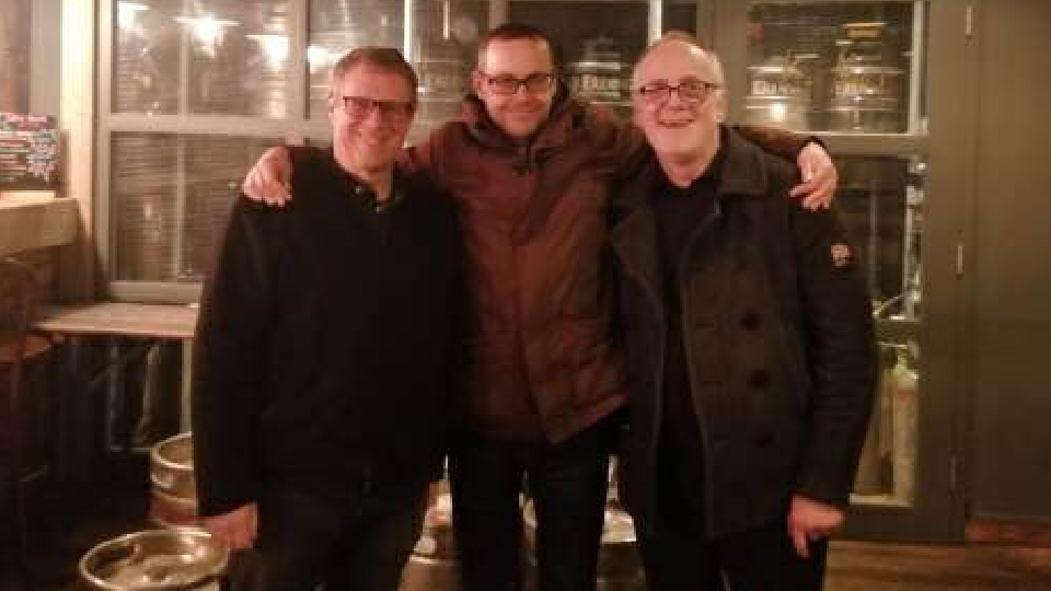 Ready to rock: Mick Harwood is flanked (pre-lockdown) by fellow Oldham Rocks organisers Paul Chadwick (left) and Rick Parker 