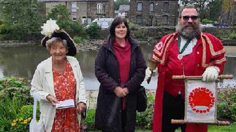 Annie Schofield is pictured with Town Crier, Marcus Emms, and Mayor of Oldham, Cllr Ginny Alexander