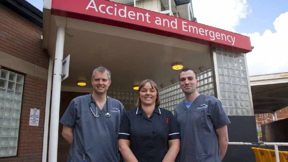 Two of the Oldham A&E team are pictured with Tom Leckie (left) Two of the Oldham A&E team are pictured with Tom Leckie (left)