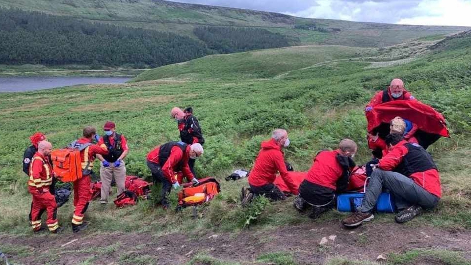 The Mountain Rescue Team attend to the patient in Greenfield
