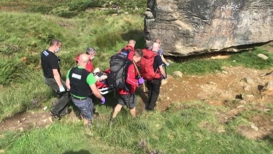 Oldham Mountain Rescue team take the woman to safety