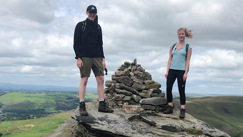 Cousins Jack Brierley and Emily Seville at the rebuilt cairn 