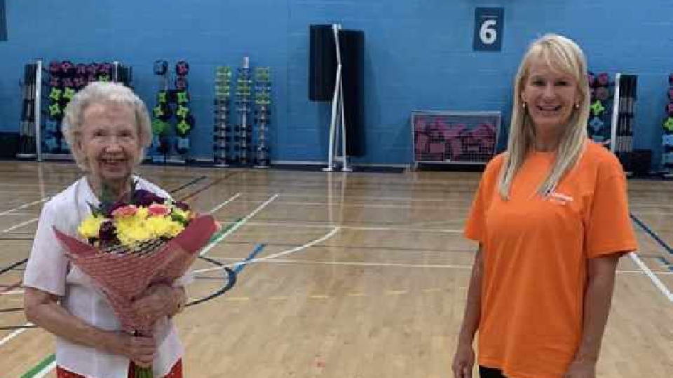 Violet Walpole is pictured with her birthday bunch of flowers Violet Walpole is pictured with her birthday bunch of flowers