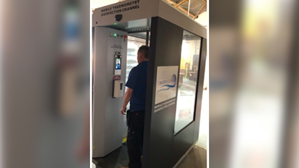 At the start of each employee’s shift, they enter the booth where facial recognition identifies them and records their temperature, while they take a dose of hand sanitiser At the start of each employee’s shift, they enter the booth where facial recognition identifies them and records their temperature, while they take a dose of hand sanitiser