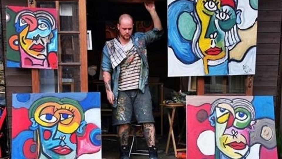 Adam Bromiley-Haslam is pictured with four of his paintings Adam Bromiley-Haslam is pictured with four of his paintings