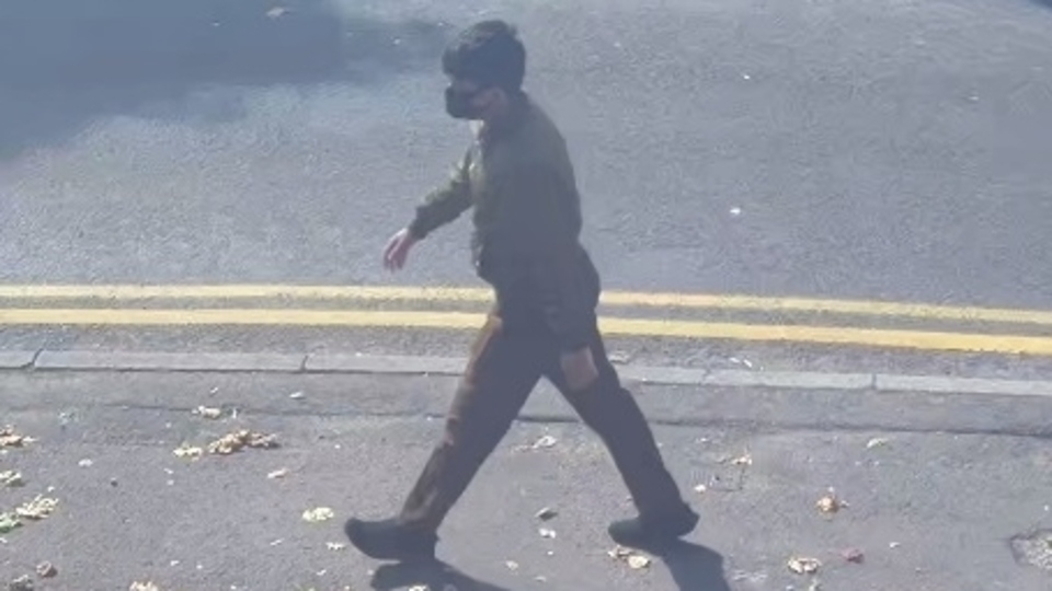 The new photo shows a male walking in the Chadderton area prior to the offence