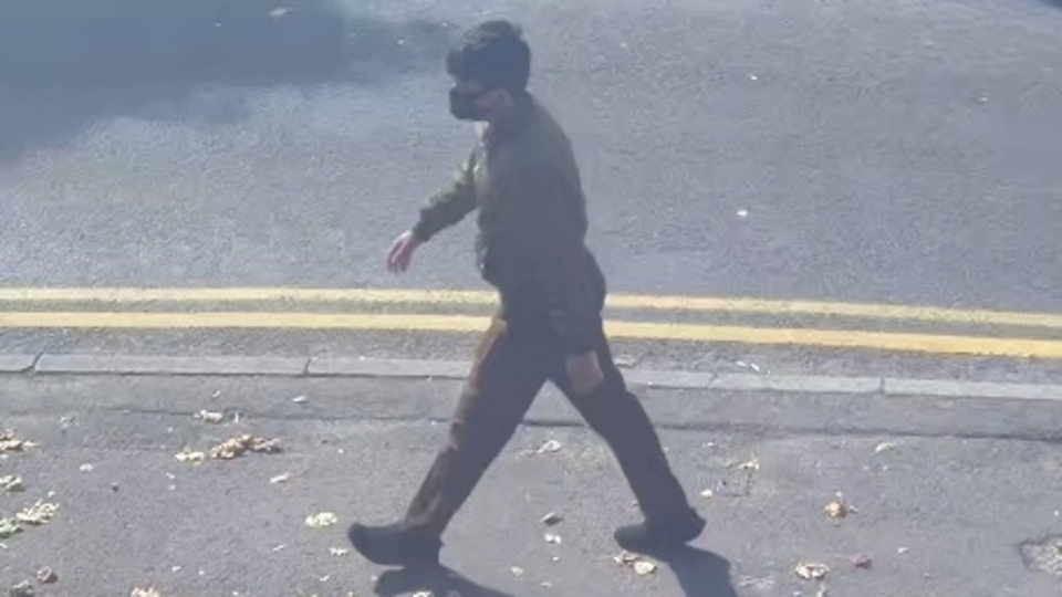The new photo shows a male walking in the Chadderton area prior to the offence The new photo shows a male walking in the Chadderton area prior to the offence