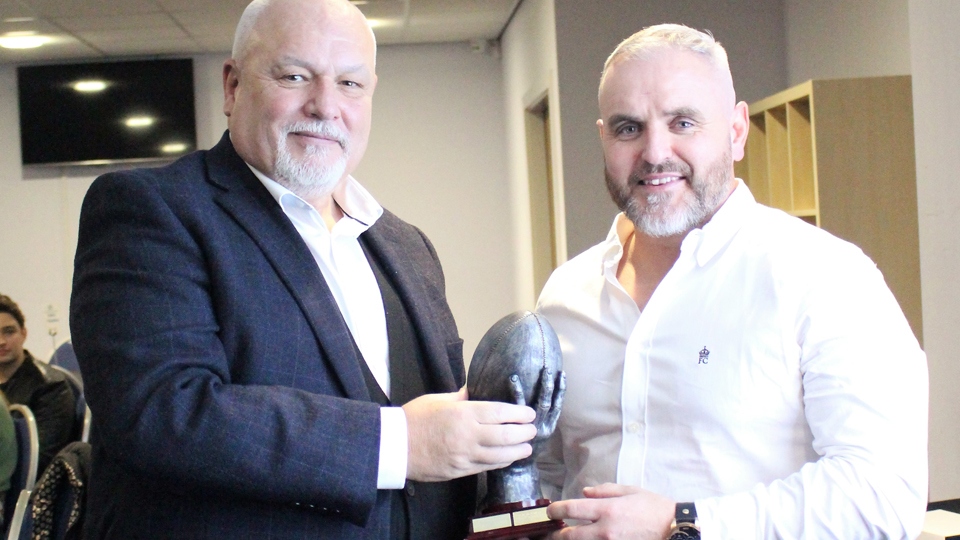 Brendan Sheridan (right) receives his clubman-of-the-year trophy from John Roddy