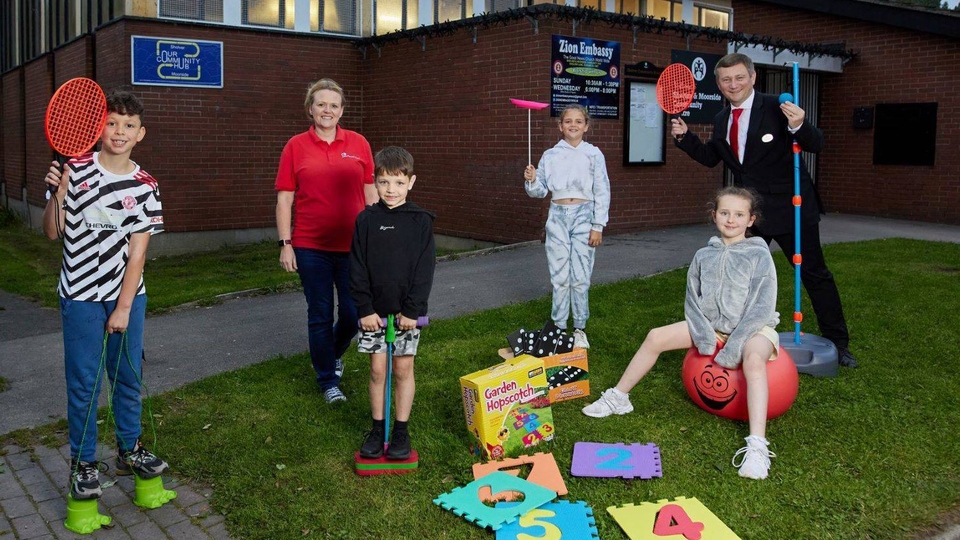 Fullcircle's Becci Drake & Redrow's Michael Deegan with the children at Sholver and Moorside junior youth club.