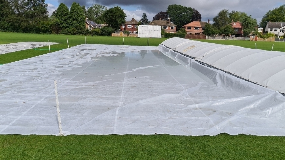 Wicket covers in place at Cheadle Hulme Cricket Club