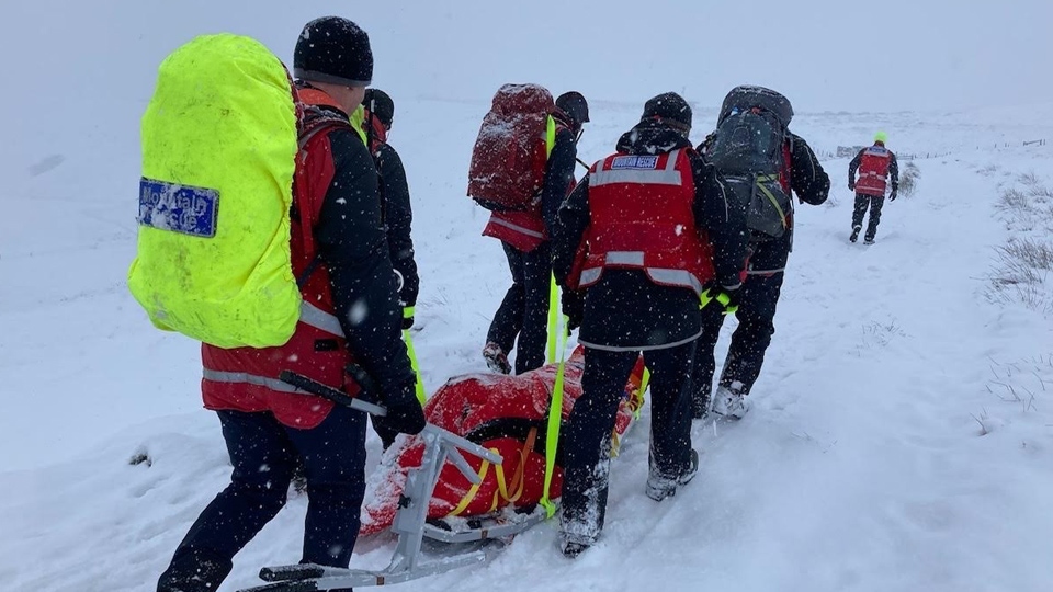 The woman was rescued from hills above Denshaw