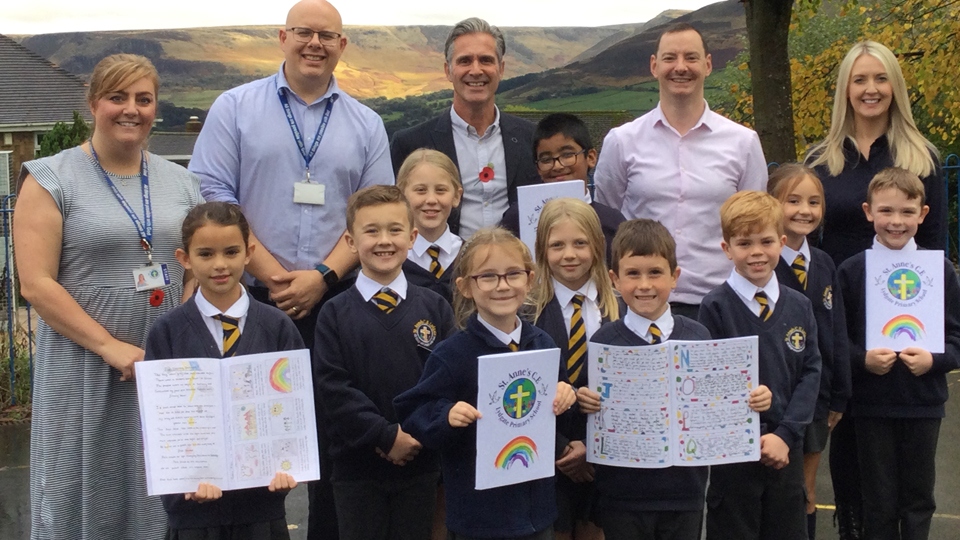 Left to right - Mrs Mostyn (Reception Teacher), Belle, Mr Bowles (TA), Oliver, Nell, Mr Learmont (Head of School), Willow, Amaan, Lottie, Seth, Mr Casey (Y5 Teacher), Elliott, Lilia, Miss Coleman (Y3 Teacher) and Finley