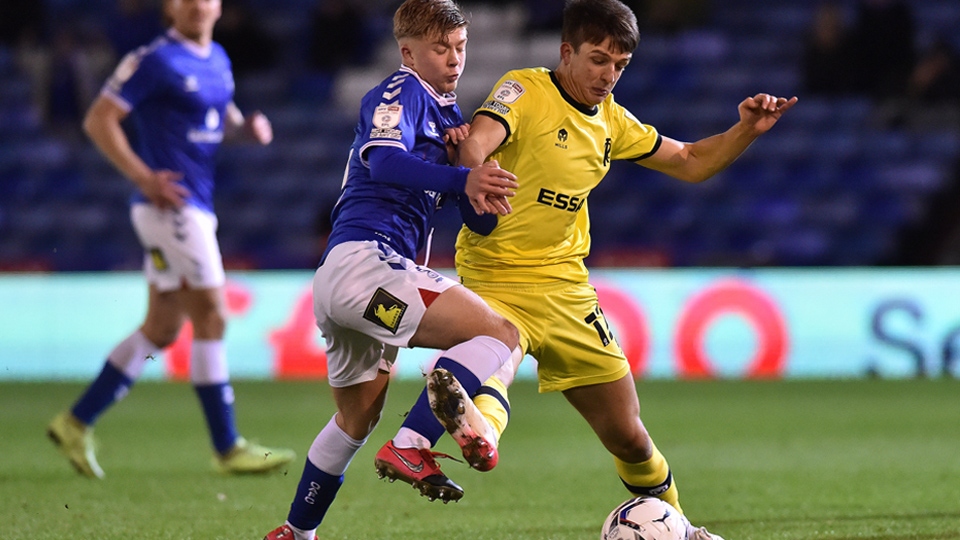 Oldham Athletic's Harry Vaughan tussles with Charlie Jolley of Tranmere Rovers