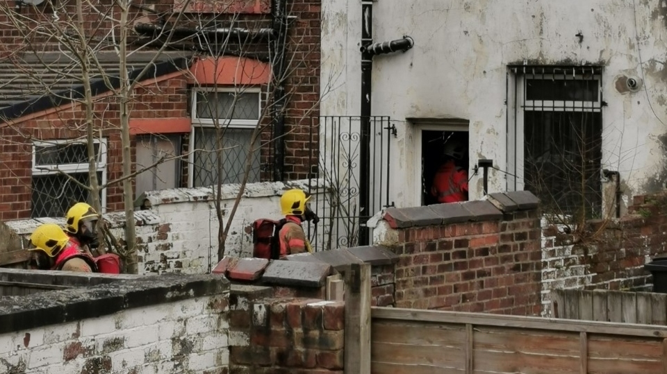 Firemen can be seen attending the property on Hollins Road yesterday Firemen can be seen attending the property on Hollins Road yesterday