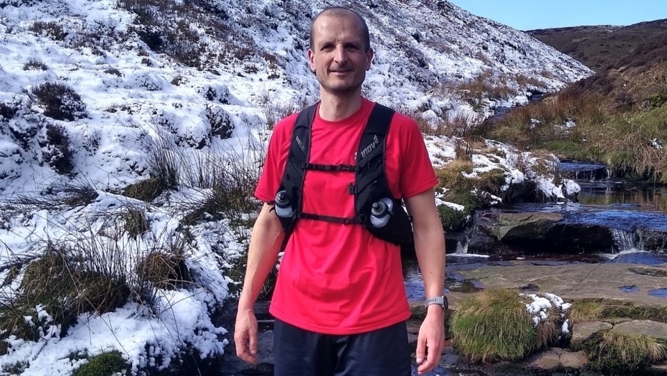 Dan Mounsey, pictured training on the Pennine hills in Saddleworth, is raising money for the Mind mental health charity in memory of his mother, Gillian Mounsey