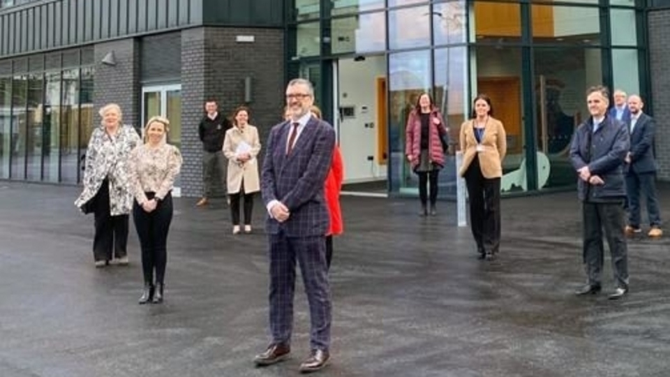 Alun Francis, Oldham College's Chief Executive and Principal, seen with some of his team outside the new building