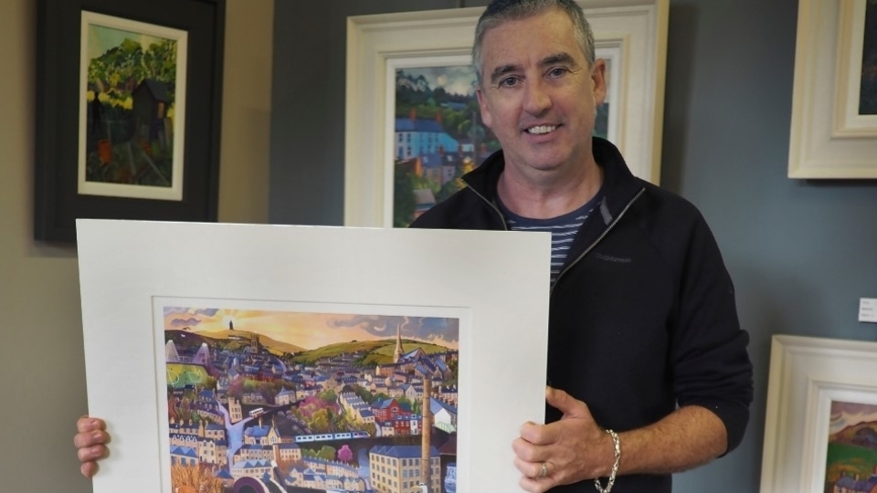 Chris Cyprus with his Old Milltown artwork