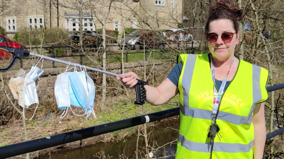 Louise Banawich pictured with a single days' collection of single use face masks picked up in Greenfield