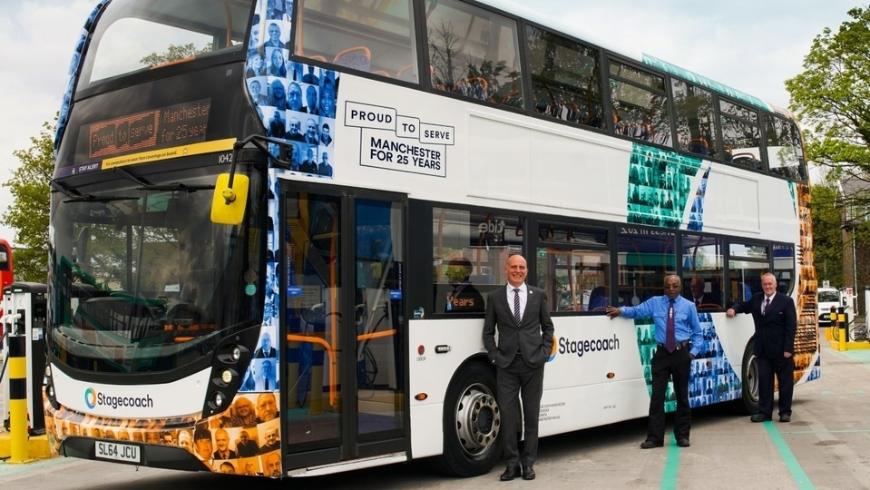 Pictured is a special livery bus featuring 30 of its longest serving members of staff