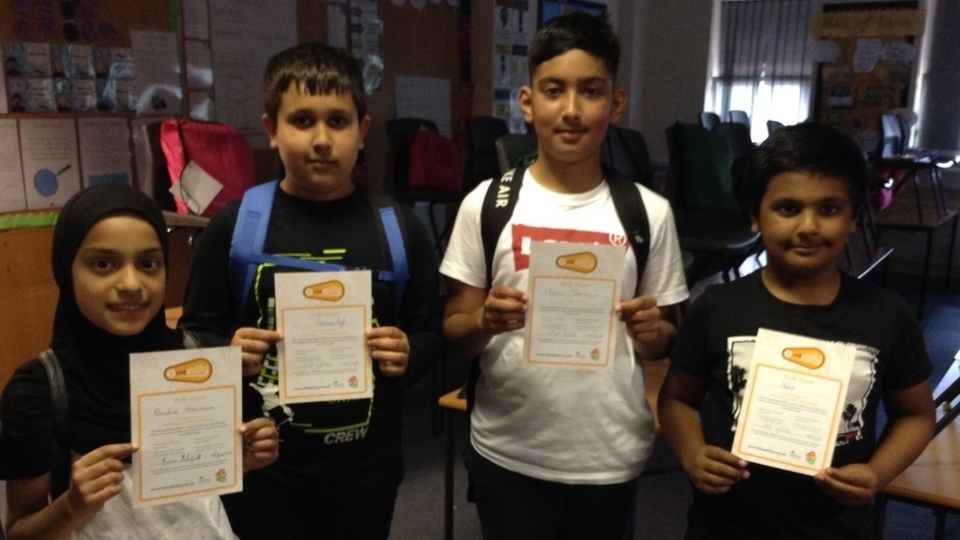 Alexandra Park Primary School children show off their Bikeability certificates