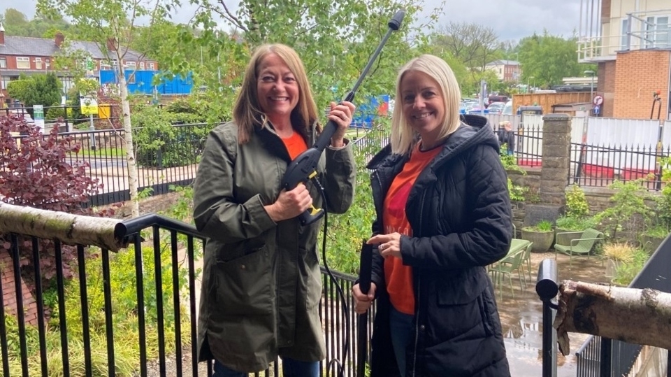 Pearson volunteers Suzanne and Dawn get stuck into the jet-washing at Maggie's Pearson volunteers Suzanne and Dawn get stuck into the jet-washing at Maggie's
