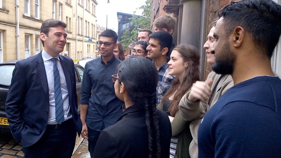 Andy Burnham is pictured meeting participants at a pre-Covid summer school Andy Burnham is pictured meeting participants at a pre-Covid summer school